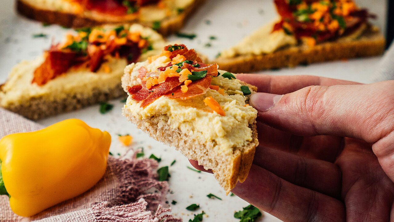 Sliced bread with hummus
