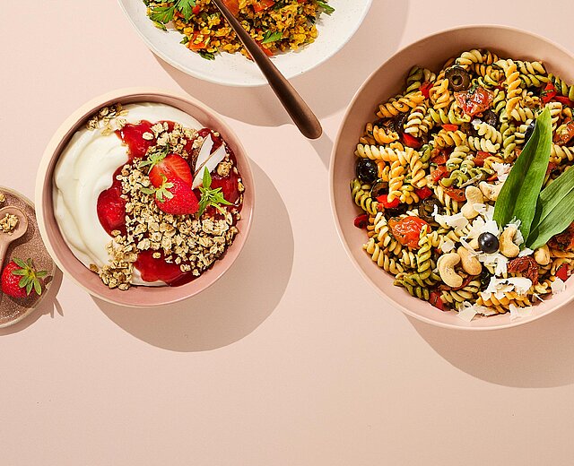 Bowls with delicatessen products and yogurt bowl